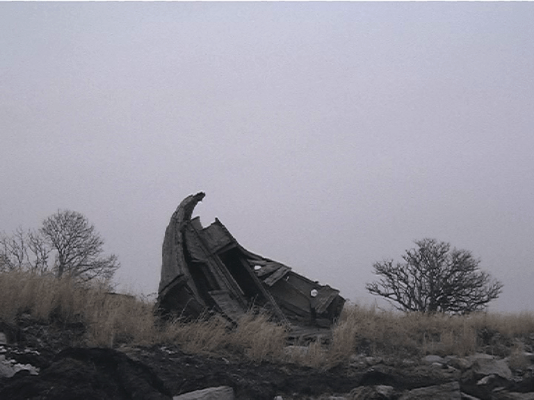 Old boat by the shore